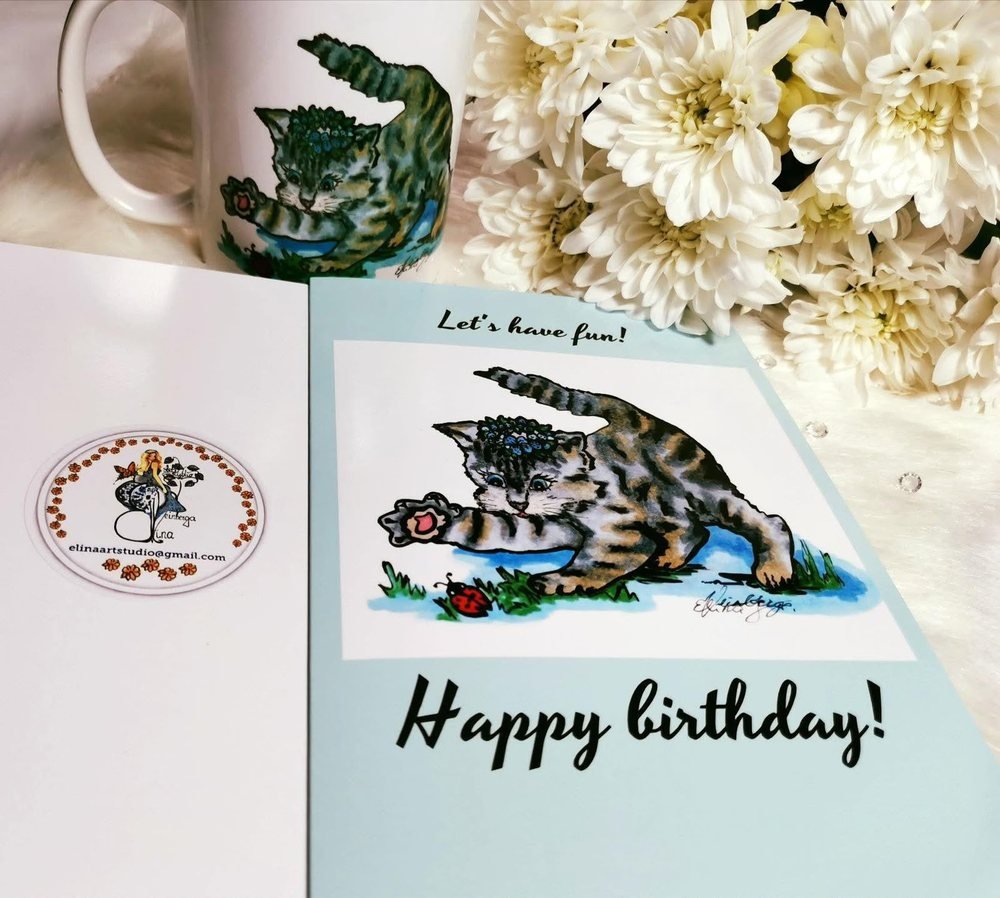 One of my first cards, a birthday kitten, next to a matching printed mug