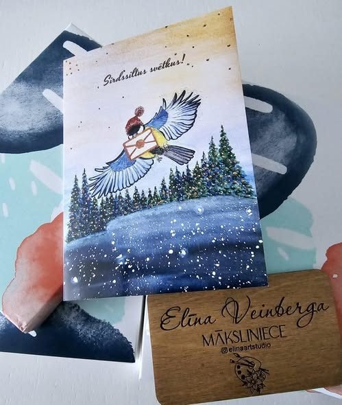 A Christmas card of a bird carrying a letter, received from Elina Art Studio
